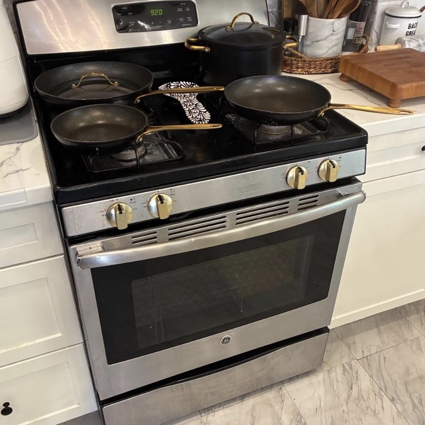 Matte gold knobs on a GE stainless gas range (customer photo)